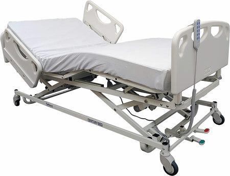 Electric adjustable long term care bed with white frame and white padding, equipped with head and footboards and locking swivel casters.