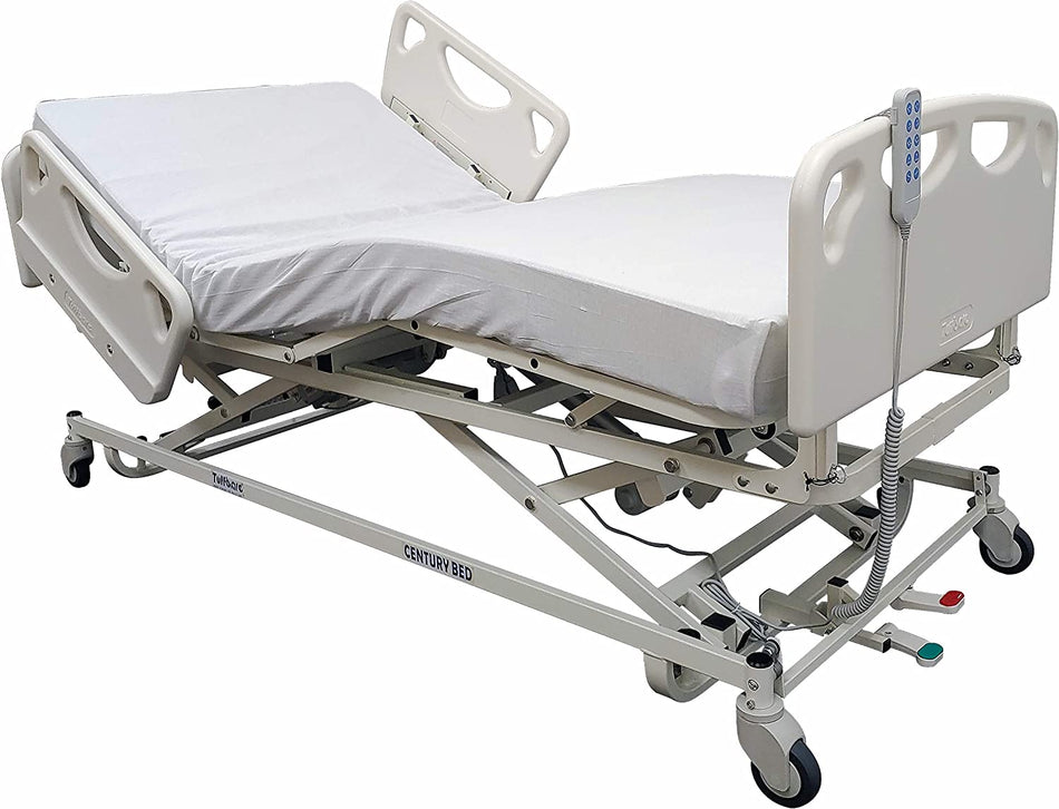 Electric adjustable long term care bed with white frame and white padding, equipped with head and footboards and locking swivel casters.
