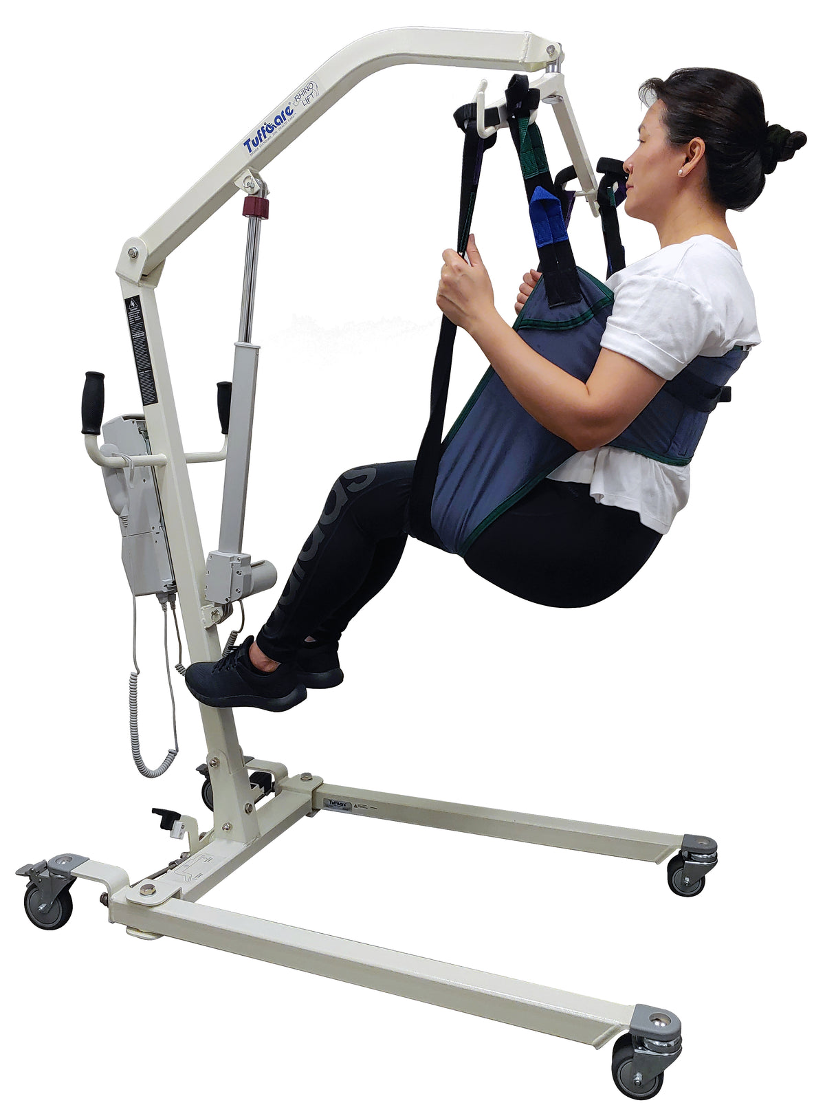 Tuffcare universal padded toileting patient lift sling in use by patient on lift.