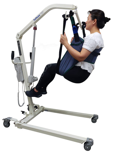 Tuffcare universal padded toileting patient lift sling in use by patient on lift.